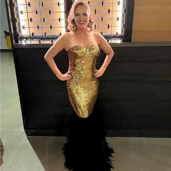 NovaLuxe XS gold glitter fitted gown with black feather mermaid style 